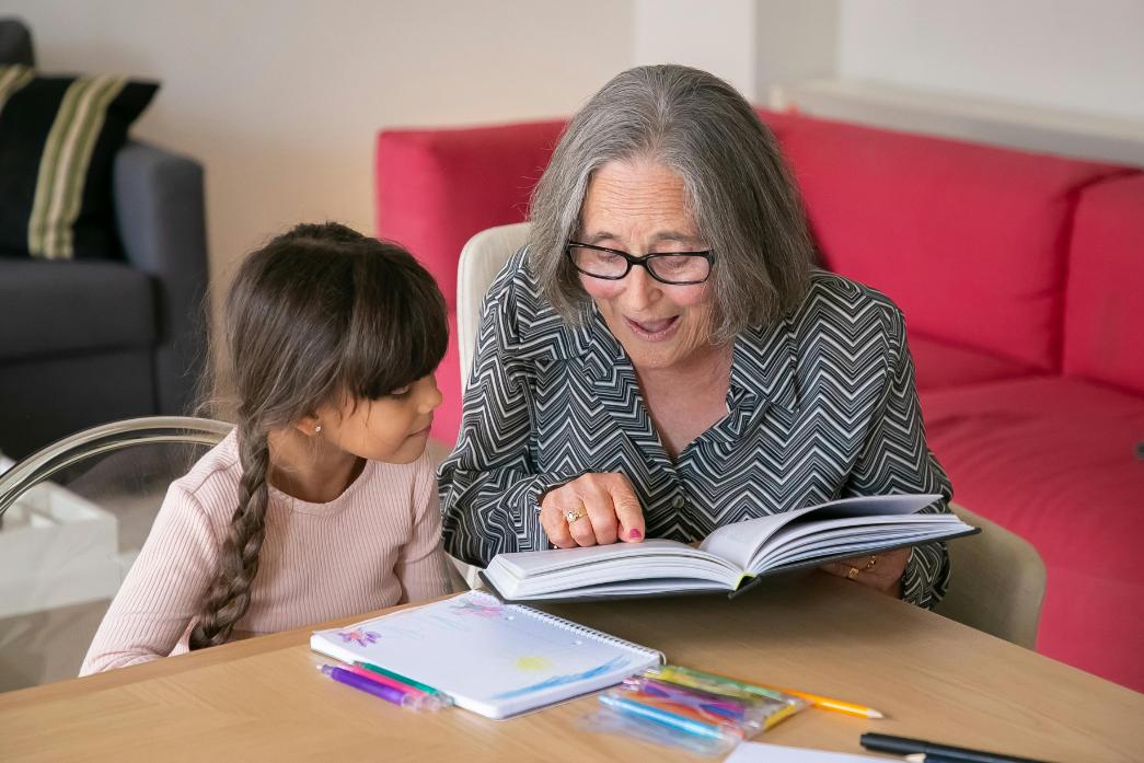 resident reading to young child