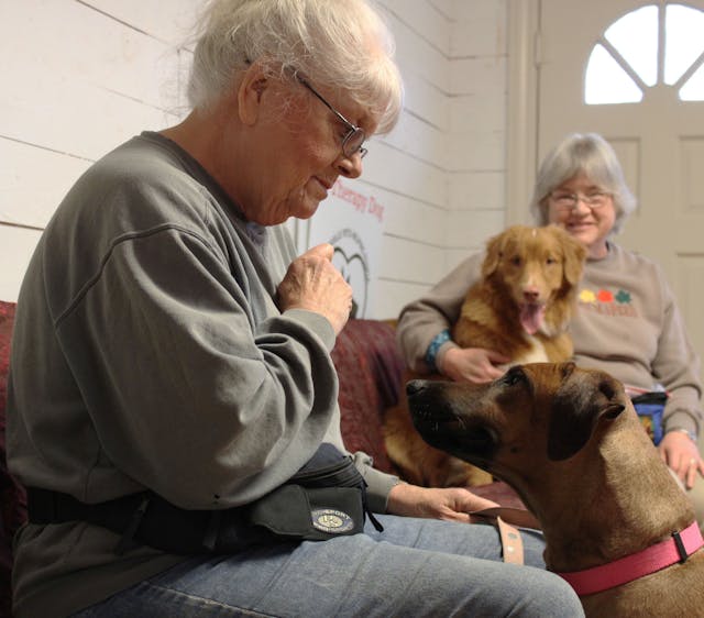 resident with therapy dog