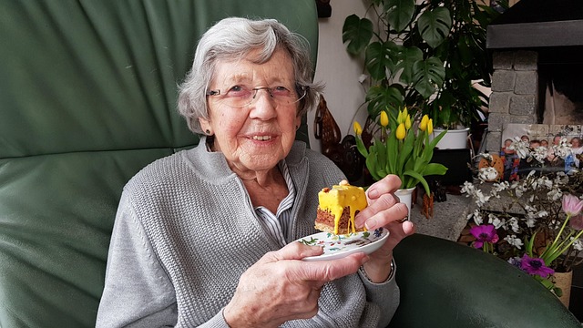 elderly woman eating cake