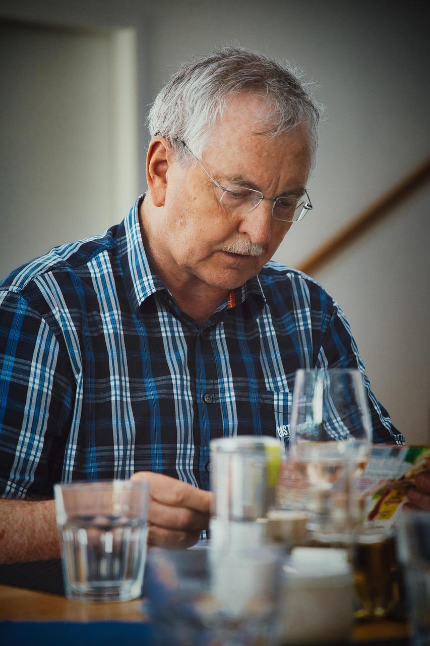 elderly man eating a meal