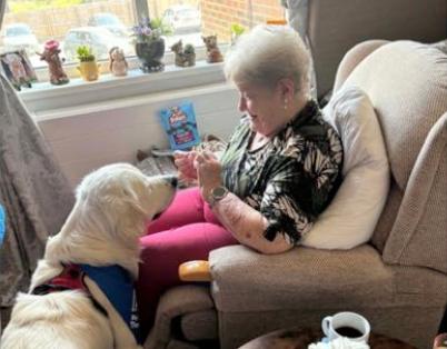 resident-petting-a-white-dog